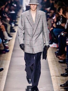 Dunhill plaid coat with peak lapels.